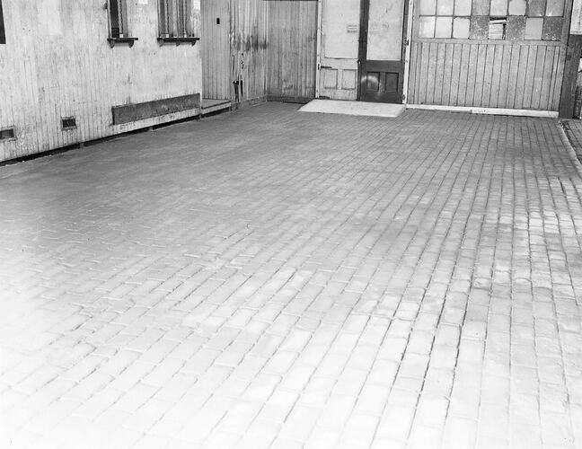 Monochrome photograph of a floor.