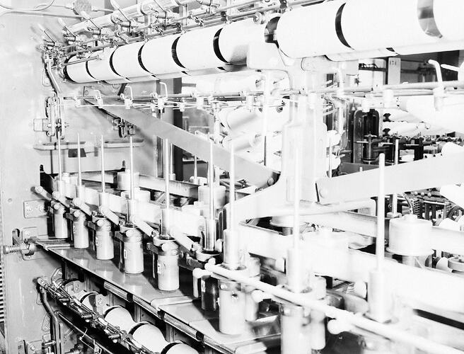 Monochrome photograph of a hoisery factory.