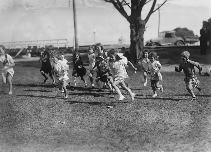 Girls running in park.
