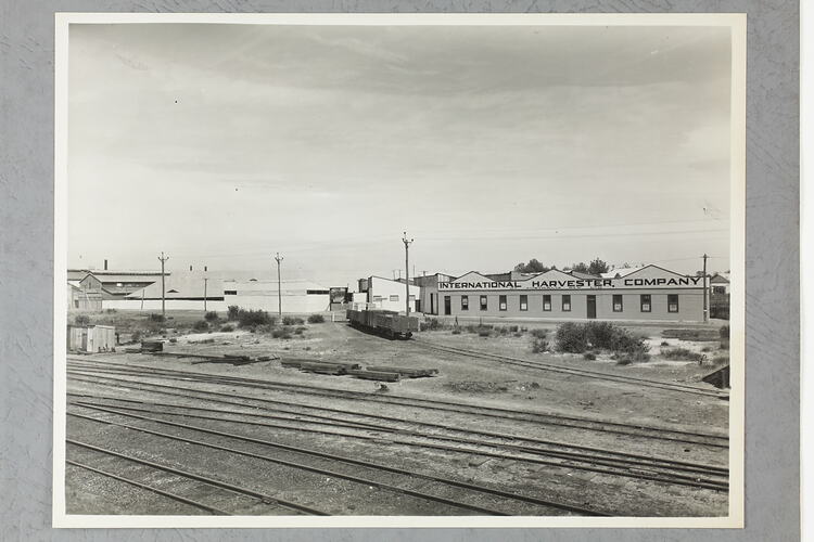 Monochrome photograph of factory exterior.