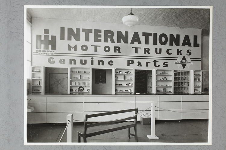 Monochrome photograph of a showroom interior.