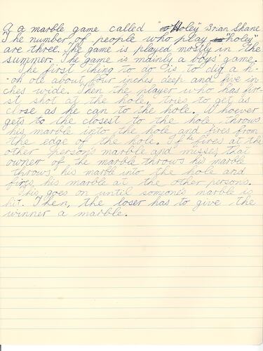 Handwritten game description in blue ink on lined paper