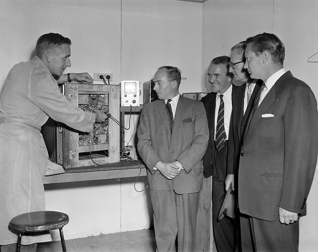 H.G. Palmer Co, Group Watching a Television Being Seviced, Moorabbin, Victoria, 14 Jan 1960
