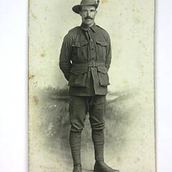 Front of postcard with portrait of soldier.