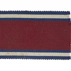 Ribbon with red, blue and white stripes.