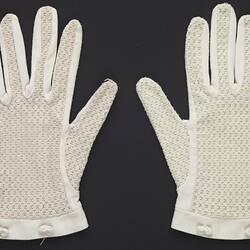 Wrist length white gloves with lace. Each glove has a two small bows on outside wrist band.