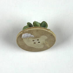 Toy plate of flowers, underside.