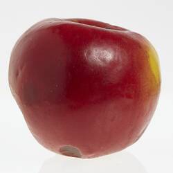 Wax apple model painted red.