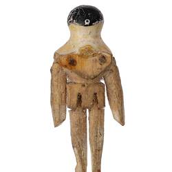 Back view of wooden doll with painted head and shoulders.