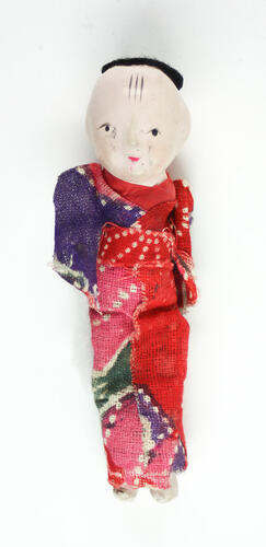 Small Japanese doll in kimono, front side.
