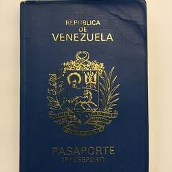 Navy passport cover with gold printing.