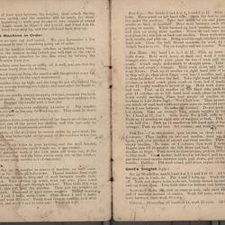 Open booklet with off-white pages and black printed text.