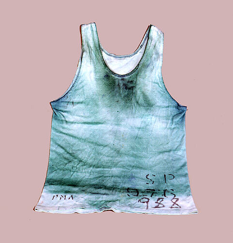 White singlet with blue stains.