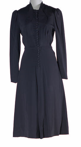 Navy dress with long sleeves and belt.