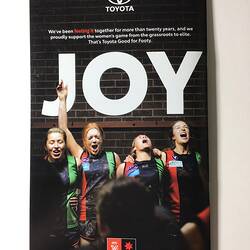 Football record back cover with four celebrating female footballers. White text, dark background.