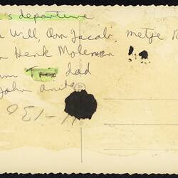 Discoloured white back of photograph with handwriting.