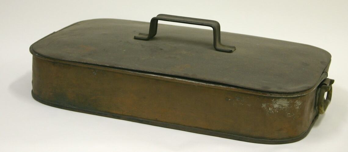 Copper baking pan, viewed from side.