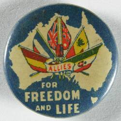Front of badge with Australia outline and flags.