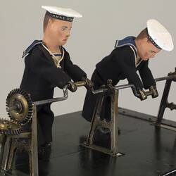Mechanical amusement with little sailor men.