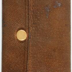 Brown rectangular wallet with metal press stud.