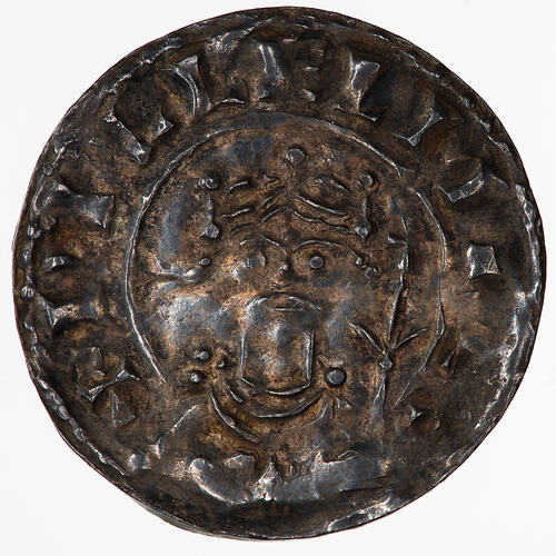 Coin, round, A crowned and diademed bust of the King facing; to right, a sceptre; text around, + PILLELM REX.