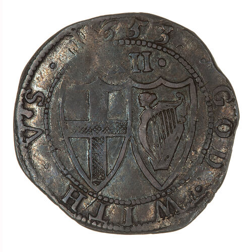 Coin, round, within a beaded circle two conjoined shields; one has St. George cross, the other the Irish harp.