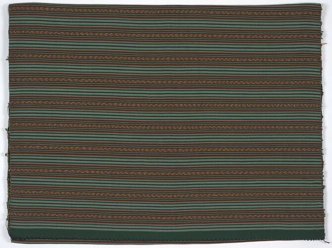 Fabric with green and brown horizontal stripe pattern.