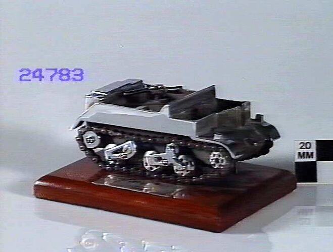 Model tank on wooden bade.