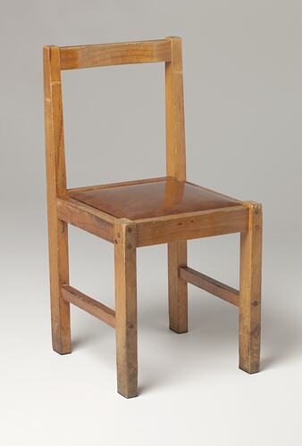 Front view of wooden chair.