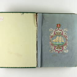 Front page of scrapbook with sailing ship image.