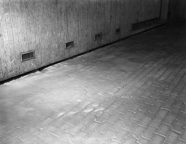 Monochrome photograph of a floor.