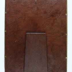 Brown cardboard backing for photograph with hinged stand