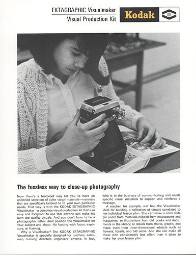 Article with photograph of woman using photographic apparatus.