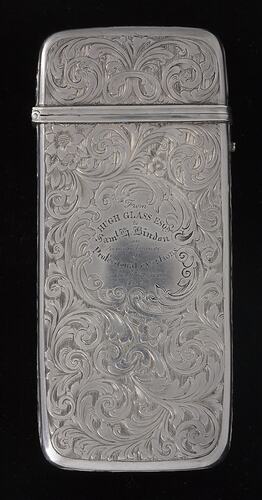 Silver cigar case with detailed engraved pattern  Text in centre. Hinged lid.