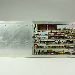 Open metal box. Case partially removed to show internal wires and components.