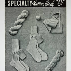 Cover of knitting book showing socks and wool.