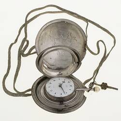 Gentleman's pocket watch in case and attached to silver plaited chain.