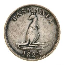 Round token with raised text and kangaroo.
