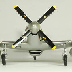 Silver model aeroplane. Front view of propeller.