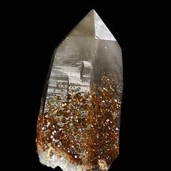 Orange crystals on a larger white prism.