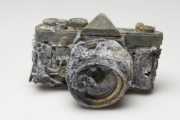 Fire afffected melted metal and plastic camera.