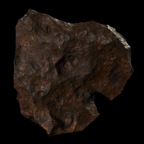 Pitted brown rock.