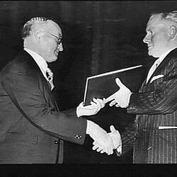 Photograph - H.V. McKay Massey Harris, Sunshine Harvester Diamond Jubilee, Fred Bult Presenting Book of Signatures to C.N. McKay, Melbourne, Victoria, 21 Aug 1944