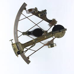 Brass scientific instrument, overhead view.