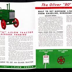 Open booklet, tractor image with red, black and green printing.