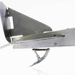 Model of a bi-plane made mostly of aluminium sheet metal. Detail view of tail.