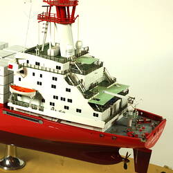 Container ship with red hull, detail of rear deck.