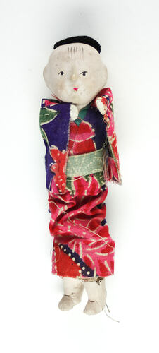 Small Japanese doll in kimono, front side.