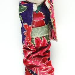 Small Japanese doll in kimono, front side.