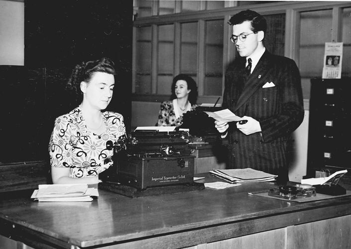 PURCHASING FOR PRODUCTION: THE H.V.MCKAY CITY OFFICE LOCATED AT 401 COLLINS STREET, MELBOURNE, PLAYS A VERY IMPORTANT PART IN THE DAILY ACTIVITIES. PHOTO SHOWS THREE YOUNG OFFICE STAFF: `SUNSHINE REVIEW' APRIL 1950